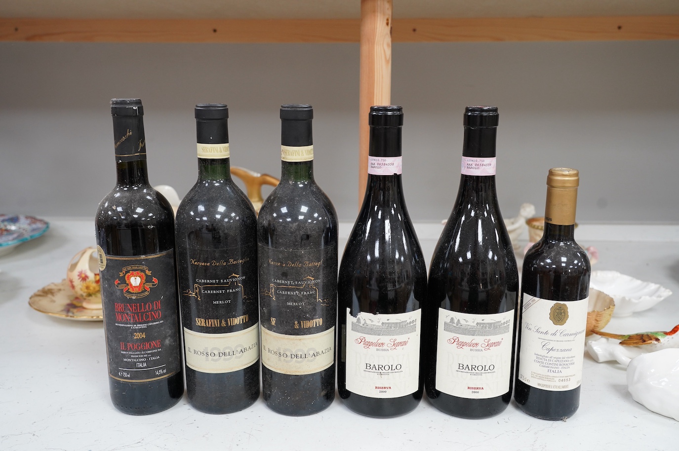 Six Italian bottles of wine to include two bottles of Il Rosso Dell’ Abazia 1999, two bottles of Pianpolvere Soprano Barolo Riserva 2000, a bottle of Brunello Di Montalcino Il Poggione 2004 and a 375ml bottle of Vin Sant